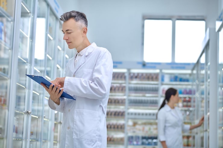 two-pharmacists-making-medicines-revision-drugstore_259150-57966